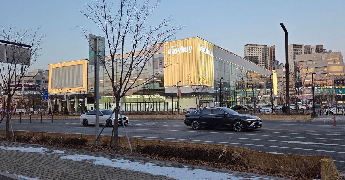 The modern yellow exterior of the large Easy Buy Supermarket building in Bongdam, Hwaseong