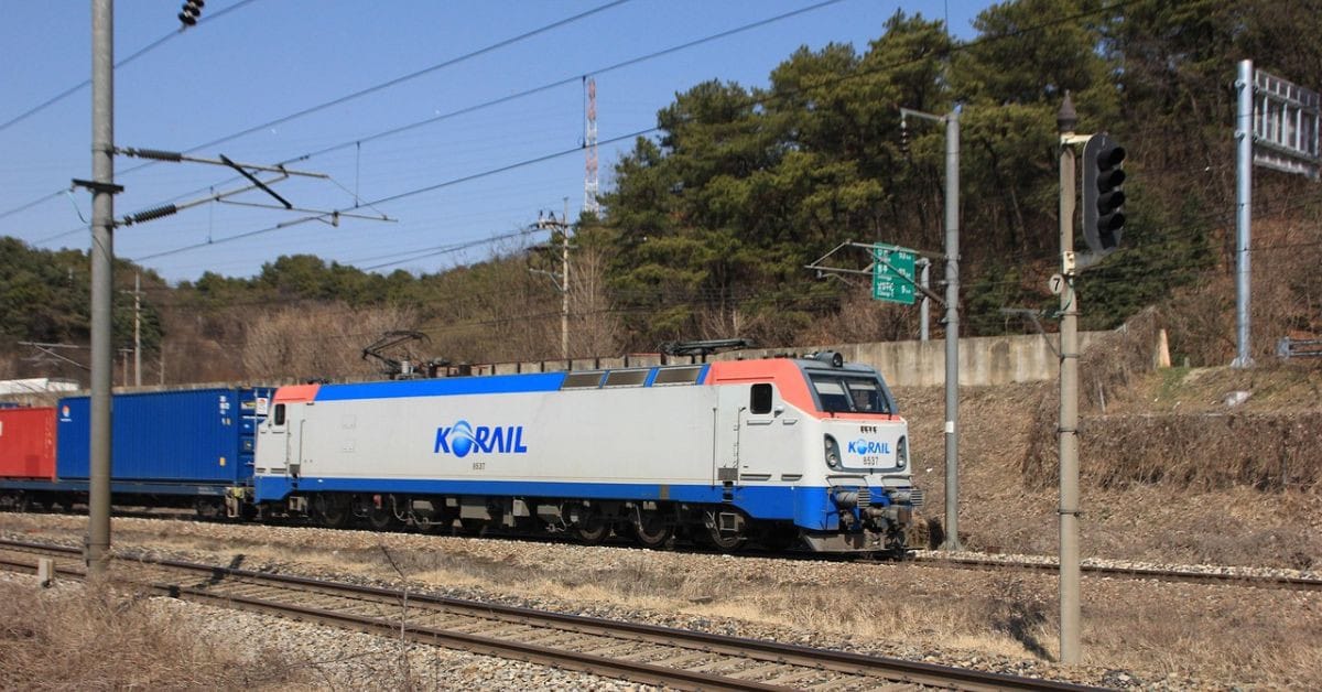 A Korail locomotive traveling on the railway tracks in South Korea.