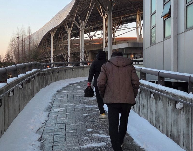 Walking path leading to Hwaseong Indoor Sports Stadium before a Korean Volleyball Game during winter