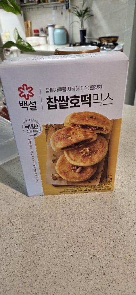 A cardboard box containing a Korean hotteok pancake mix resting on a flat surface.