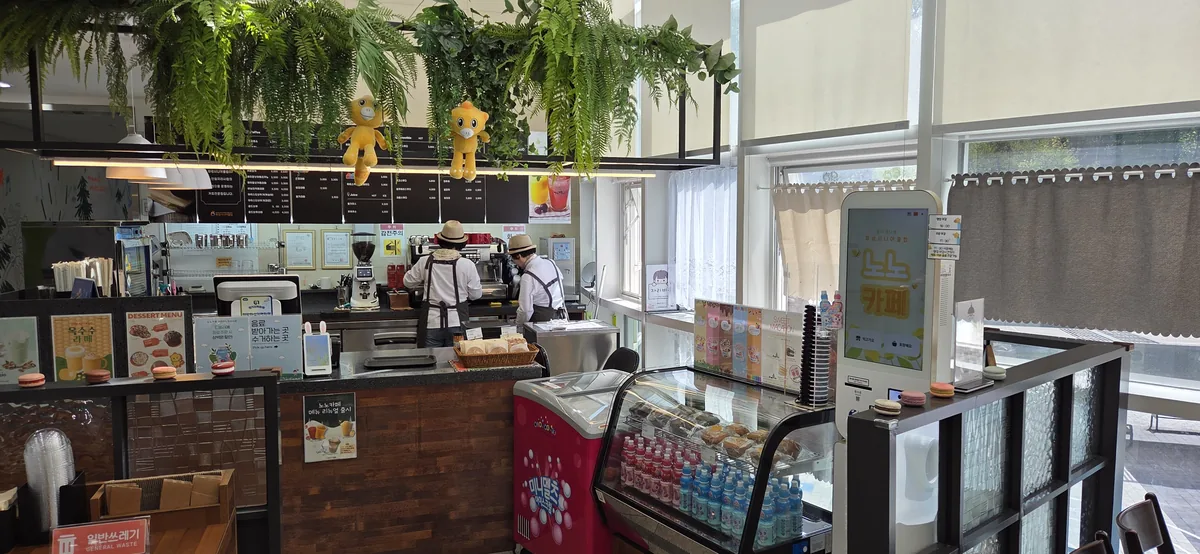 Second floor cafe seating area at Hwaseong Bongdam Toy Library