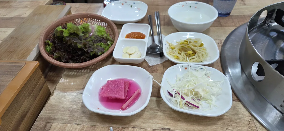 A vibrant array of banchan, perfect for expat couples Korean dining.