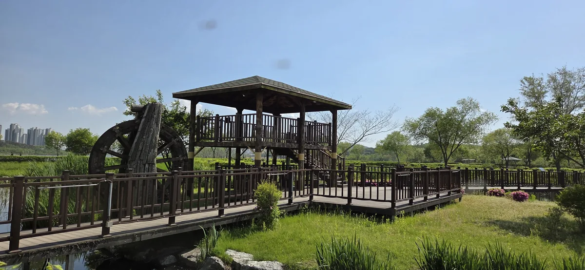 A large hydro wheel feature at Uiwang Rail Park's waterfront