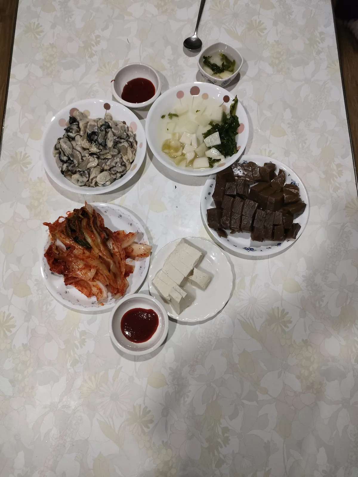 A cozy post-labor dinner featuring fresh oysters, dotorimuk, and kimjang kimchi family tradition expat korea.