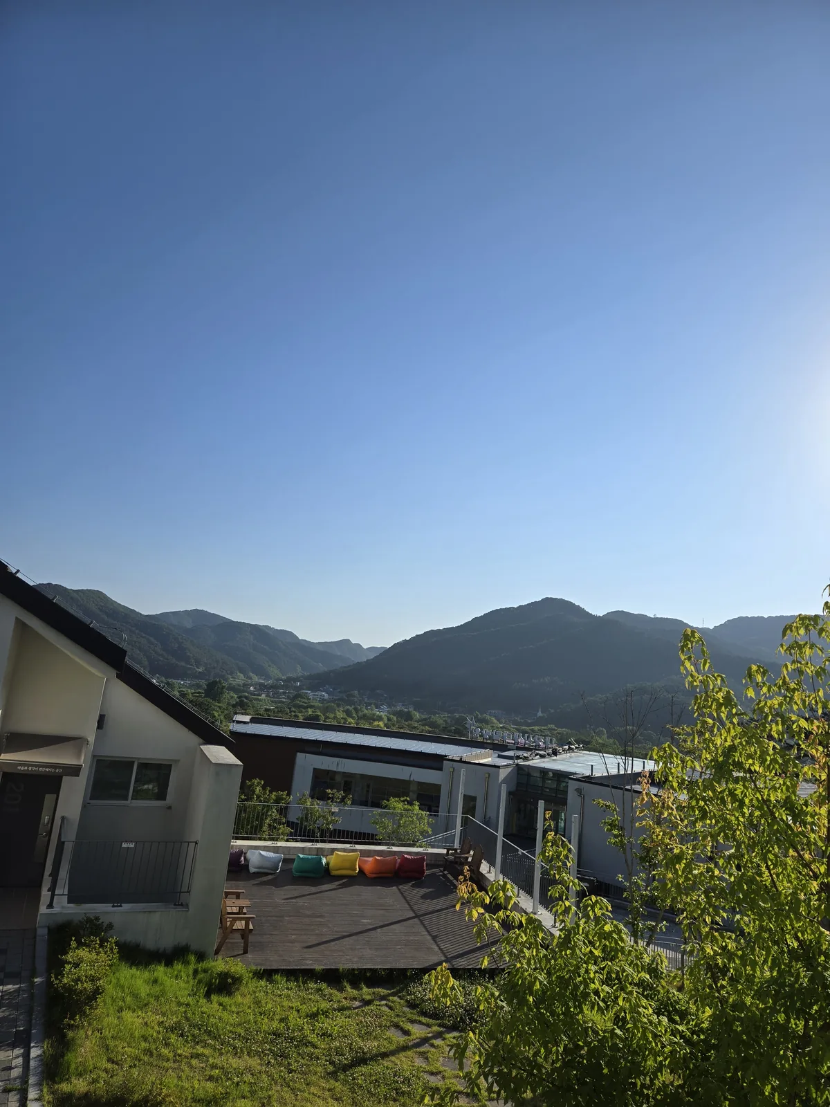 Exterior view of the Naejangsan Eco-Exploration Center accommodation, nestled in lush greenery.